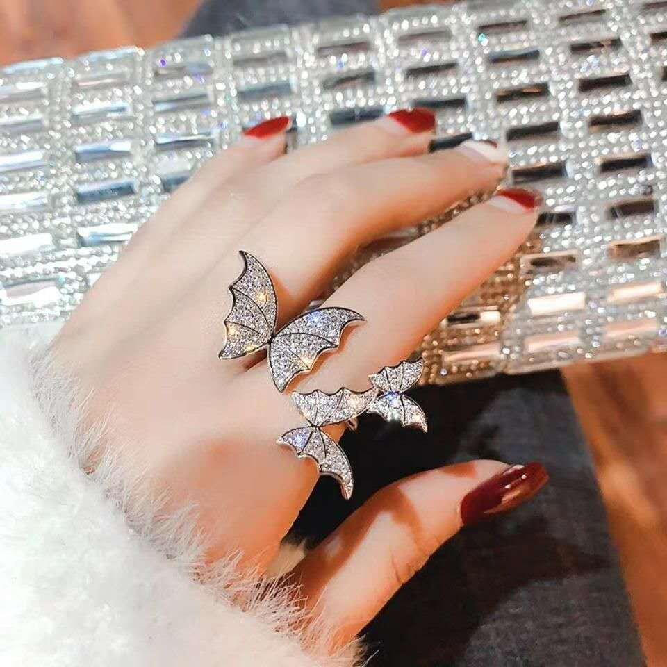 Gem engraved butterfly ring